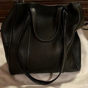 Large tall black tote . About 9-10 inches tall and 7 inches wide.